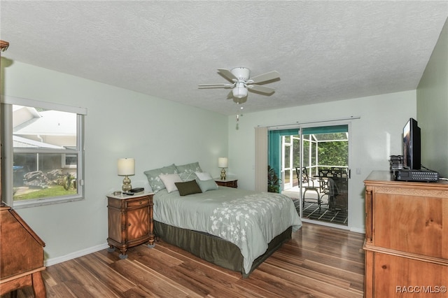 bedroom featuring access to outside, ceiling fan, dark wood-type flooring, and a textured ceiling