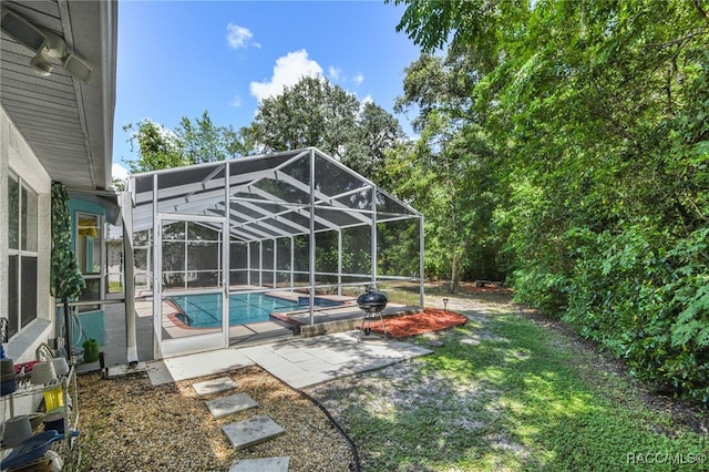 view of pool featuring a patio area and a lanai