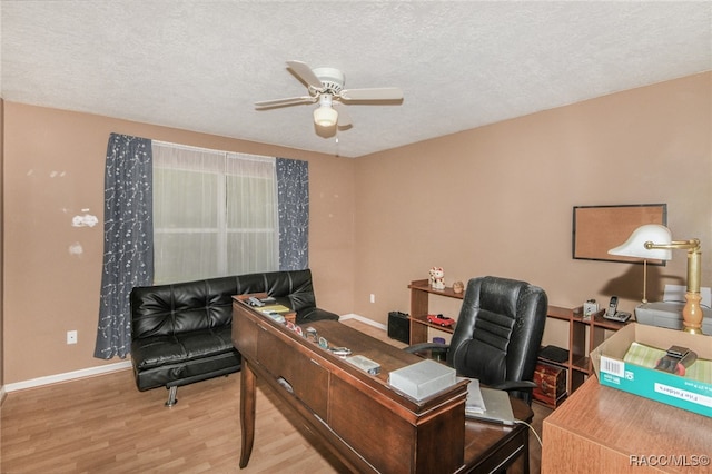 office featuring ceiling fan, a textured ceiling, and hardwood / wood-style flooring