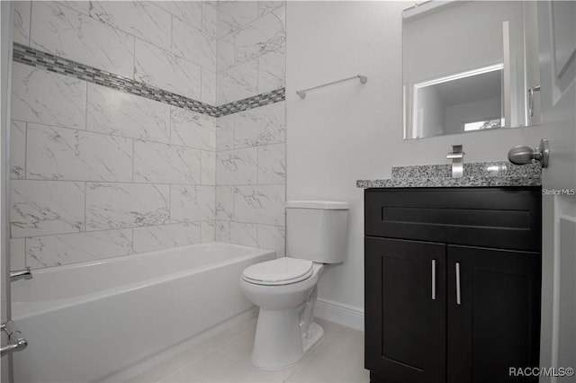 full bathroom with toilet, vanity, and tiled shower / bath