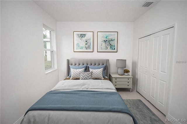 bedroom featuring a closet and a textured ceiling