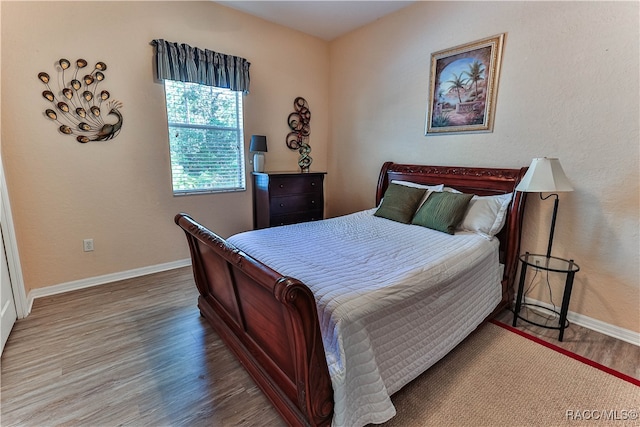 bedroom featuring hardwood / wood-style flooring