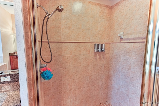 bathroom featuring a shower with door