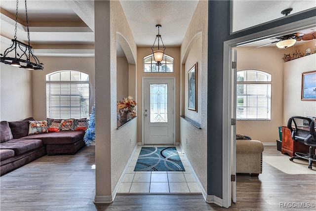 foyer featuring hardwood / wood-style floors and a textured ceiling