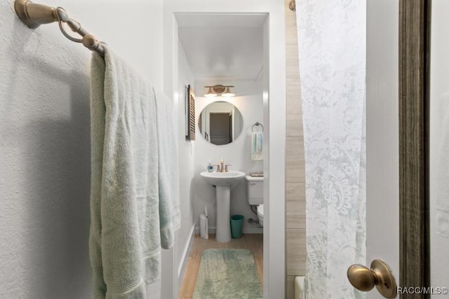 10684 W Halls River Rd Unit 2, Homosassa, FL 34448 - full bathroom featuring wood finished floors and a sink
