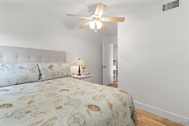 10684 W Halls River Rd Unit 2, Homosassa, FL 34448 - bedroom featuring wood finished floors and a ceiling fan