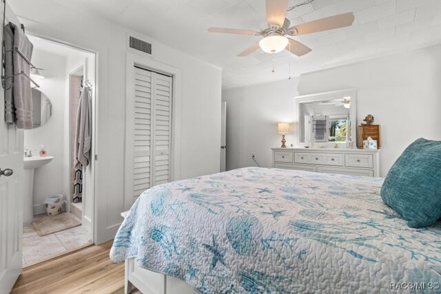 10684 W Halls River Rd Unit 2, Homosassa, FL 34448 - bedroom featuring light wood finished floors, a closet, and a ceiling fan