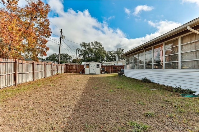 view of yard with a storage unit