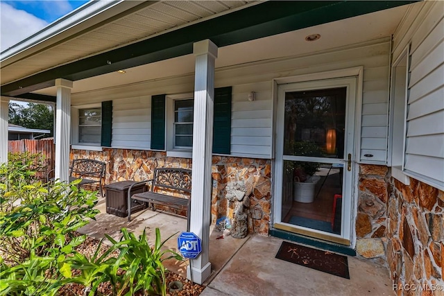 property entrance featuring a porch