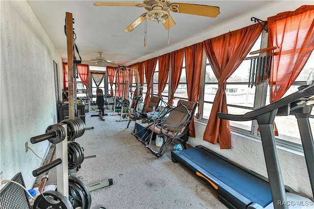 exercise room with ceiling fan