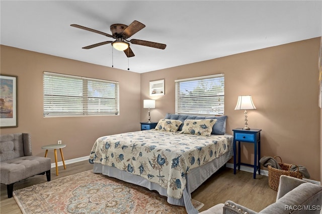 4 S Columbus St, Beverly Hills, FL 34465 - bedroom with multiple windows, wood finished floors, and ceiling fan
