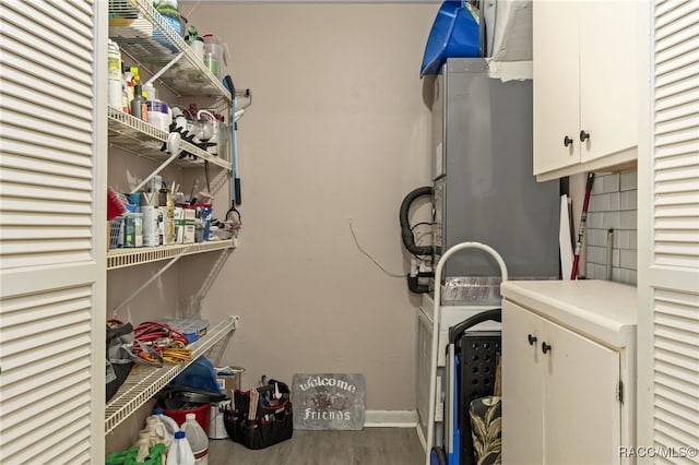 4 S Columbus St, Beverly Hills, FL 34465 - laundry area featuring cabinet space and wood finished floors