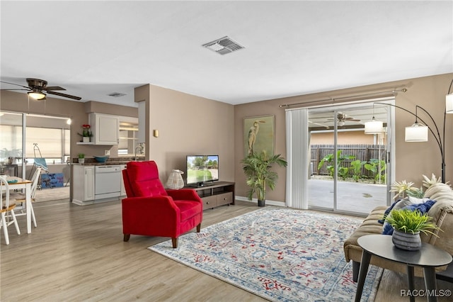 4 S Columbus St, Beverly Hills, FL 34465 - living room with a ceiling fan and light wood-style floors