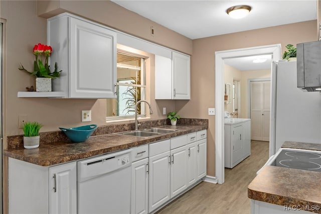 4 S Columbus St, Beverly Hills, FL 34465 - kitchen featuring washing machine and clothes dryer, white appliances, and white cabinetry
