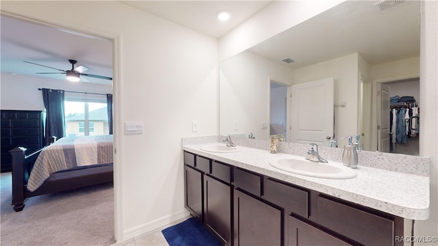 bathroom featuring ceiling fan and vanity