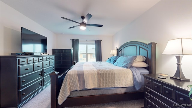 carpeted bedroom with ceiling fan