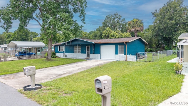 8 S Columbus St, Beverly Hills, FL 34465 - view of front facade with driveway, a garage, and brick siding
