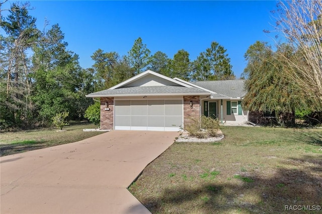 ranch-style house featuring a front lawn, driveway, an attached garage, a shingled roof, and brick siding