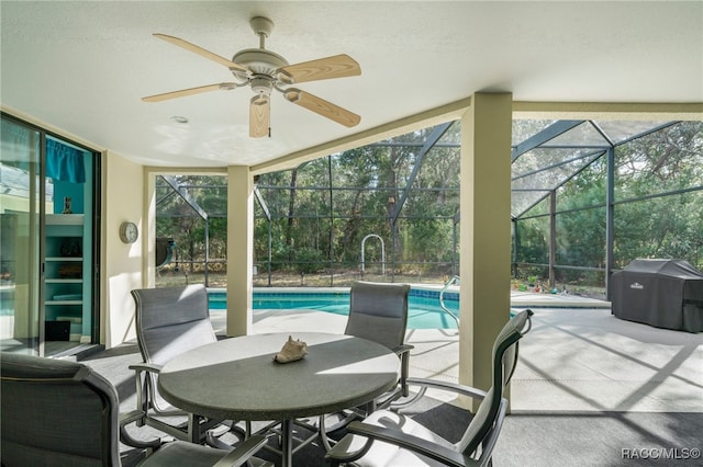 exterior space with ceiling fan, area for grilling, and a lanai