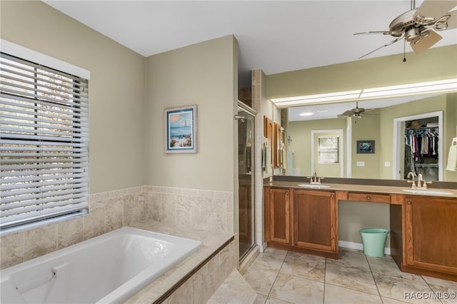 bathroom with vanity, independent shower and bath, and ceiling fan