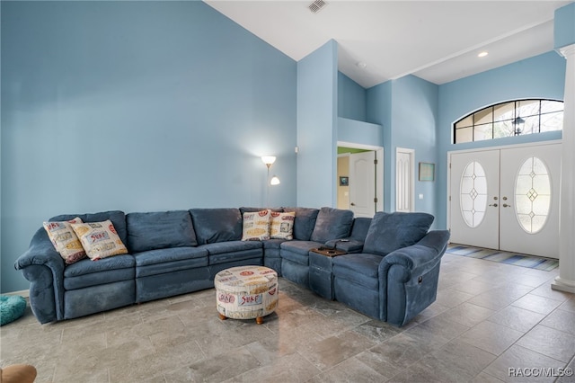 living room featuring high vaulted ceiling