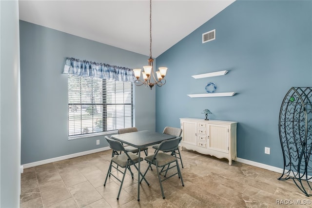 dining area featuring lofted ceiling and a chandelier