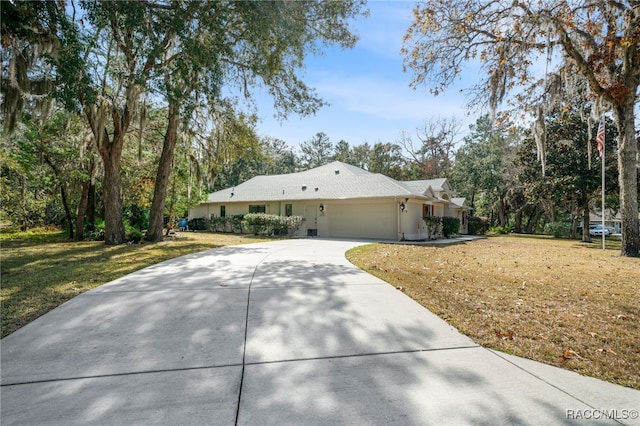 view of home's exterior with a garage and a yard