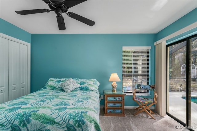 carpeted bedroom with access to exterior, ceiling fan, and a closet