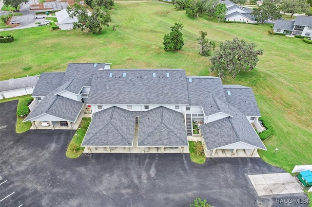 birds eye view of property with a residential view