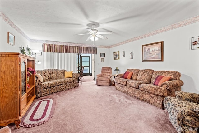 carpeted living room featuring a textured ceiling and ceiling fan