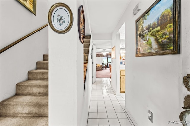 hall with light tile patterned flooring