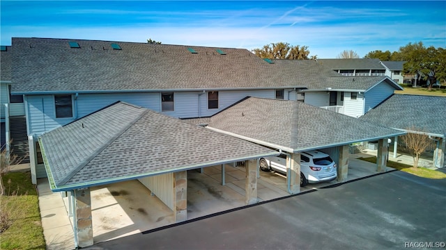 rear view of property featuring a carport