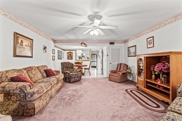 carpeted living room featuring ceiling fan