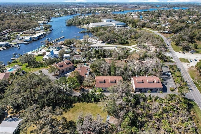 drone / aerial view with a residential view and a water view