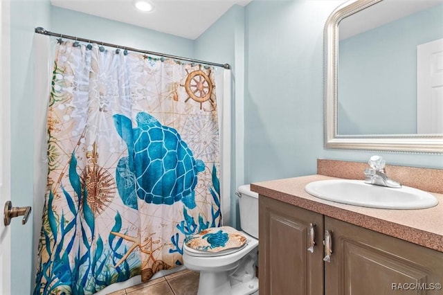 full bath featuring toilet, tile patterned flooring, and vanity