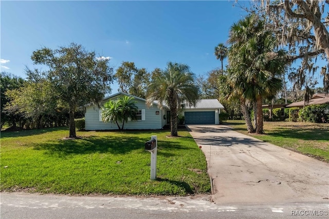 view of front of house featuring a front yard and a garage