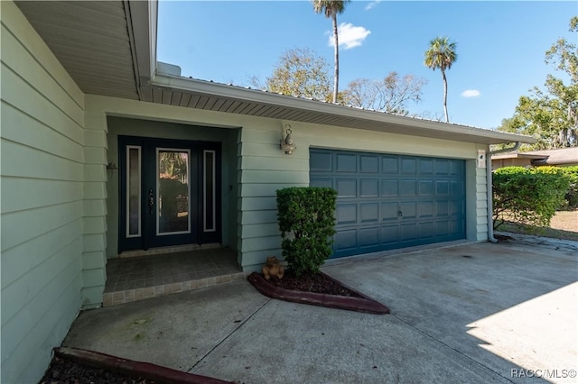 property entrance with a garage