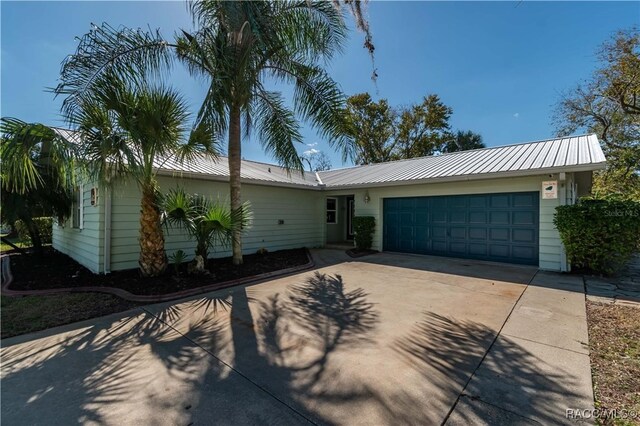 single story home with a garage