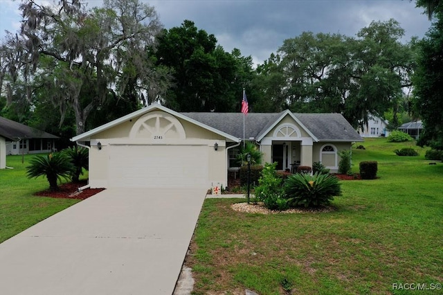 2745 N Canterbury Lake Dr, Hernando, FL 34442 - single story home featuring driveway, a front yard, a garage, and stucco siding