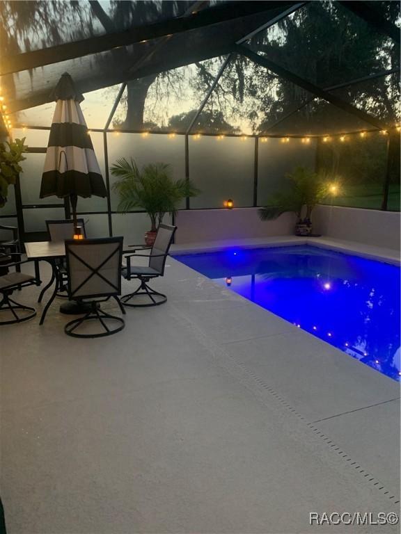 2745 N Canterbury Lake Dr, Hernando, FL 34442 - swimming pool with a patio and glass enclosure