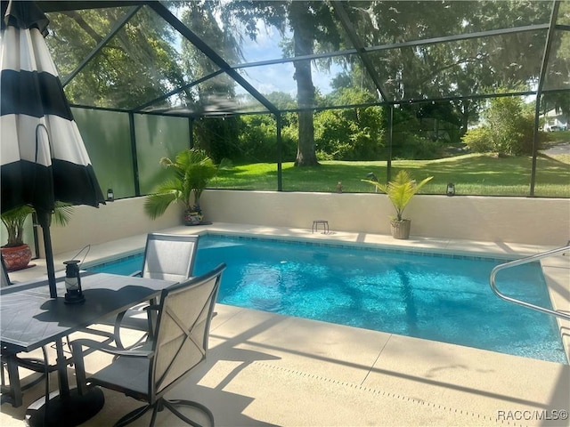2745 N Canterbury Lake Dr, Hernando, FL 34442 - swimming pool with glass enclosure, a patio, and a lawn