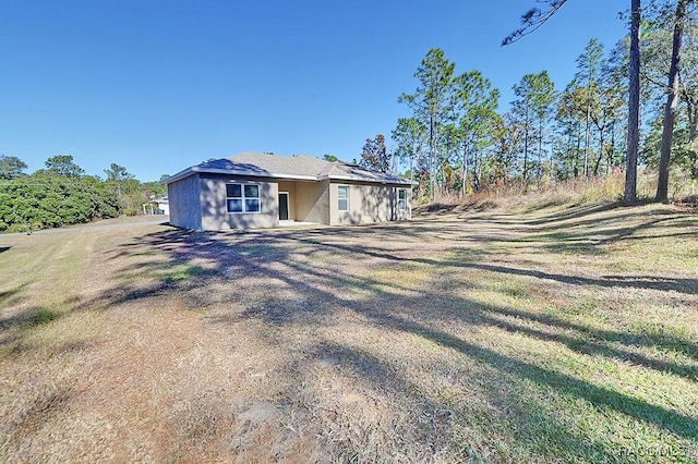 exterior space with a yard