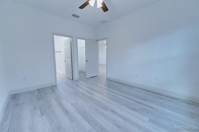 spare room featuring ceiling fan and light hardwood / wood-style floors