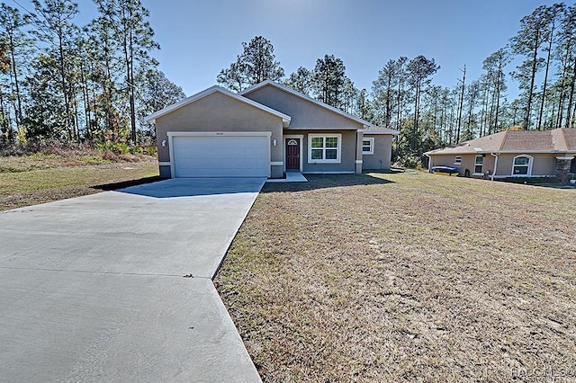 single story home featuring a garage and a front lawn