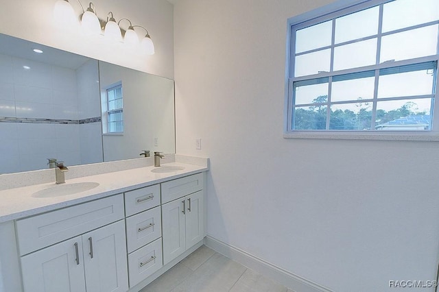 bathroom with tile patterned floors and vanity