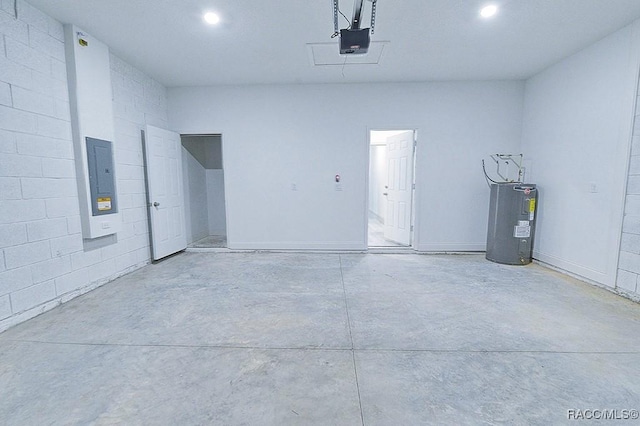 garage with electric panel, a garage door opener, and water heater