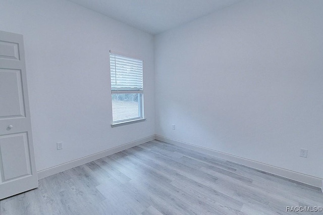 empty room with light hardwood / wood-style floors