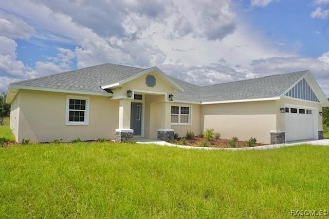 653 E Connecticut Ln, Hernando, FL 34442 - view of front of house with stucco siding, a garage, a front lawn, and roof with shingles