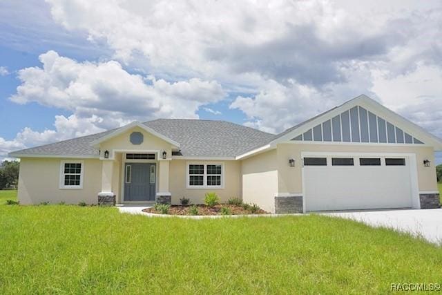 653 E Connecticut Ln, Hernando, FL 34442 - view of front of property with stucco siding, an attached garage, a front lawn, concrete driveway, and roof with shingles