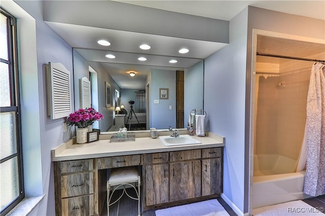 bathroom featuring vanity and shower / tub combo with curtain